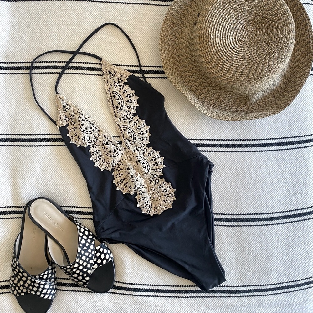 Planet Blue lace black one piece. Size S. Open back with crossing strings.